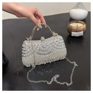 Close-up of sparkling rhinestone evening bag with elegant crystal fringe details