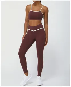 Contrast color yoga set featuring a thin-strap sports bra and cross-waist leggings.
