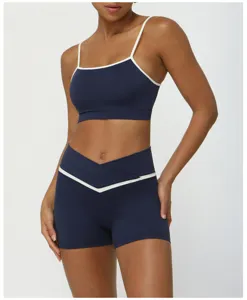 Colorblock athletic yoga set with crossover high waist shorts and thin strap sports bra.