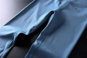 Close-up detail of women high waist buttery soft yoga pants showing fine stitching and fabric.
