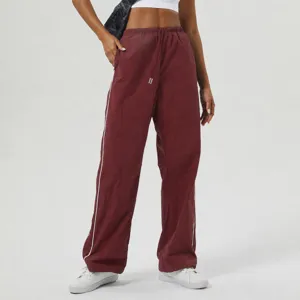 Casual loose straight athletic cargo pants with drawstring and side stripes for women.
