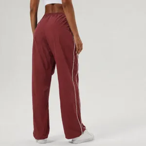 Contrast piping casual sports pants with elastic drawstring waist and adjustable hem for fitness.