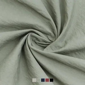 Sage green lightweight wrinkle woven fabric, premium 100% nylon soft smooth textile material.