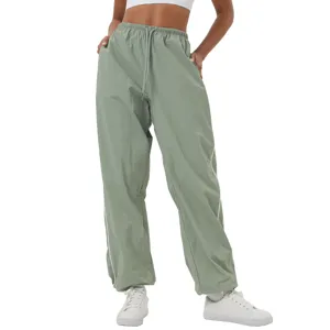Sage green cargo pants for women, loose straight leg athletic trousers with drawstring waist.