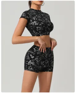 Women silver foil activewear set short sleeve crop top and matching shorts for workout fitness.