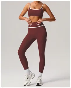 Women's activewear set, maroon sports bra and high-waisted fitness yoga leggings with white trim.