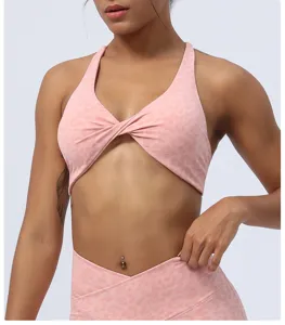 Soutien-gorge de sport imprimé léopard rose avec nœud avant, vue détaillée pour fitness.