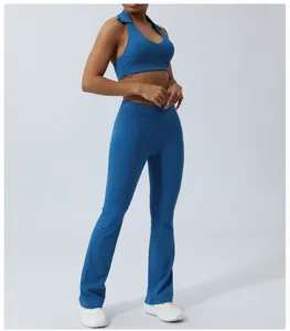 Close-up detail showcasing the blue yoga set with a halter crop top and flared pants.