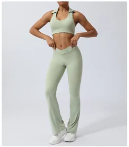 Light green yoga set featuring a stylish halter sports bra and high waist crossover flared pants.