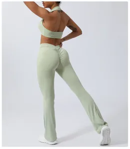 Light green yoga set detail showcasing backless crop top and butt-lifting flared pants.
