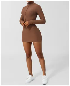 Detail view of the brown ribbed long-sleeve zip athletic romper dress in studio setting.