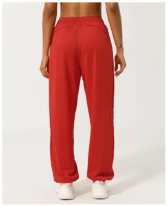 Red high-waisted sweatpants for women, casual loose joggers with elastic cuffs for daily wear.