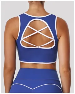 Reggiseno sportivo blu con schiena incrociata, top fitness yoga imbottito senza ferretto.