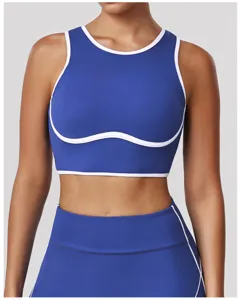 Reggiseno sportivo blu royal con dettagli a contrasto bianchi, design fitness yoga.