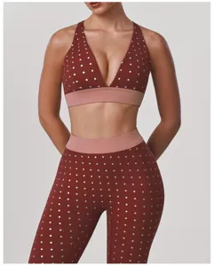 Detail view of the red-brown polka dot yoga bra and high-waist leggings set, stretchy and stylish.