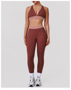 Polka dot two-piece yoga set featuring a push-up sports bra and high-waist leggings.