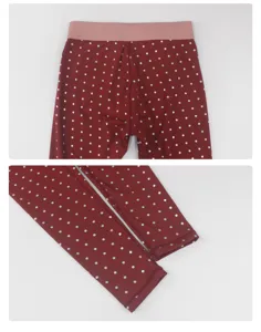 Red polka dot leggings detail shot showing elastic waistband and cute white dots pattern.