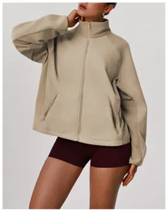 Detailed view of the khaki fleece zip jacket showcasing the stand collar and pocket.