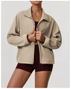 Detailed view of women zip up polar fleece jacket featuring stand collar and cozy loose fit.