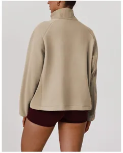 Detail view of women's beige fleece stand collar zip up jacket, soft fabric and cozy fit.