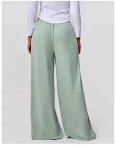 Back view detail of high-waisted draped wide-leg trousers in sage green, casual apparel.