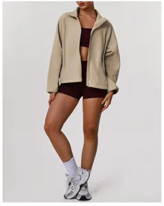 Detail view of the cozy fleece zip-up jacket showing the stand collar and soft texture.
