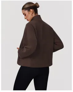Detail shot of the dark brown fleece zip-up jacket showcasing collar and fabric texture.