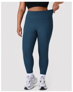 Gedetailleerd overzicht van stretch yogalegging met hoge taille in donker teal.