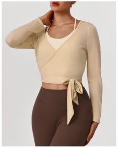 Long sleeve wrap shrug top detail view, soft stretch fabric for yoga and fitness training.