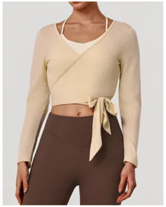 Long sleeve wrap crop top yoga set with built-in bra and matching leggings for fitness workout.