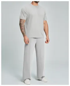 Close-up detail view of the men grey short sleeve t-shirt and long pants casual sportswear set.