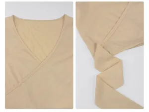 Close-up detail of the elegant beige wrap v-neck yoga top, showing fine stitching and soft fabric.