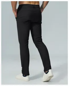 Back view detail of men's black stretch golf trousers casual pants worn with white sneakers.