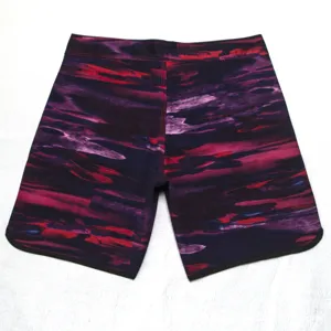 Men's abstract print board shorts detail view showcasing quick-dry four-way stretch fabric.