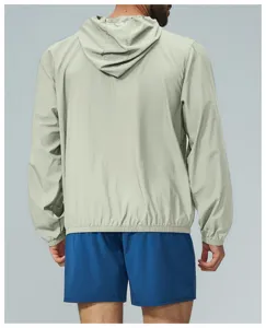 Lightweight mens hooded windbreaker detail view, casual outdoor sports jacket rear angle.