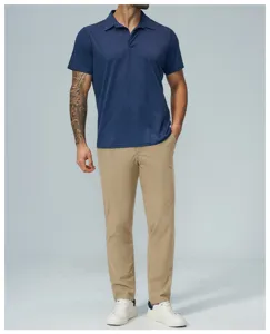 Detailed view of the casual men's outfit featuring a soft navy polo and khaki trousers.