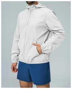 Detail view of men light grey outdoor sun protection hooded zipper jacket with pockets.