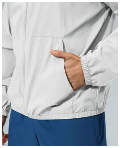 Men casual outdoor windbreaker jacket detail view showing zipper pocket and elastic cuffs design.