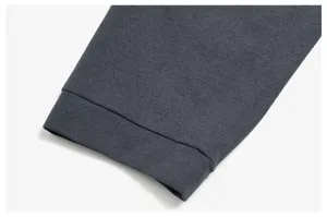 Men's breathable athletic long sleeve t-shirt detail view, dark grey mesh fabric cuff.