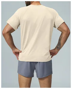 Back detail view of men light beige athletic short sleeve t-shirt and grey shorts.