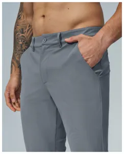Men's grey quick-dry casual golf pants detail showing straight cut, pocket and button.