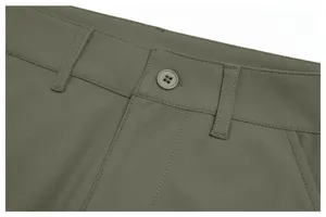 Men's green casual trousers waistband close-up detail, comfortable fabric and fine stitching.