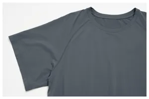 Close-up detail of men's dark grey athletic t-shirt featuring comfortable crew neck and breathable fabric.