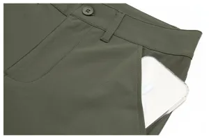 Men's golf pants detail view featuring secure pocket design, clean stitching, and waistband.