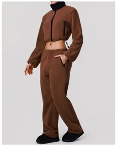Brown fleece tracksuit detail showcasing cropped zip jacket and comfortable wide-leg pants.