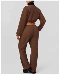 Back detail view of warm brown fleece cropped jacket and casual loose wide leg pants set.