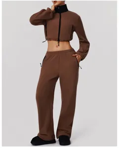 Detailed view of the brown fleece tracksuit featuring a stand collar and wide leg pants.