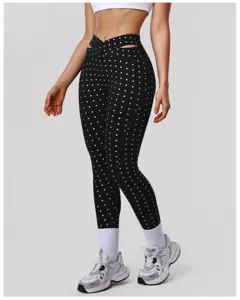 Hoge taille polkadot kruis uitsparing yoga legging voor dames, comfortabele fitness broek.