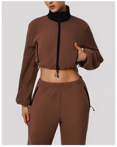 Detailed view showing the soft brown fleece fabric texture and high collar design.