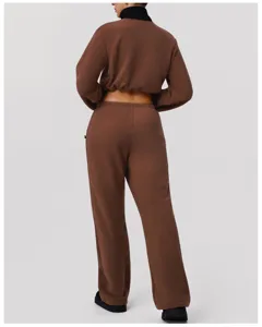 Back view detail of thick polar fleece brown casual jacket and wide-leg trousers set.